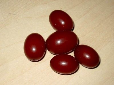 FIVE VINTAGE GRADUATED CHERRY AMBER BAKELITE BEADS, 31g  