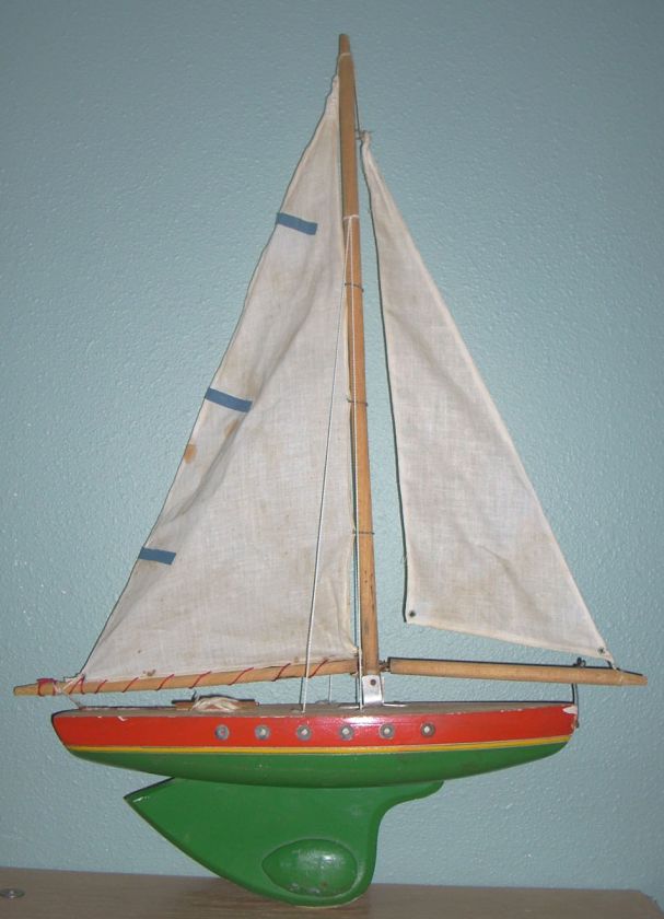 This a Vintage Hand Made Wooden Pond Sailboat.