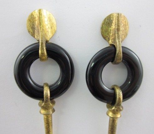 You are bidding on a DESIGNER Black Resin Gold Tone Dagger Dangle 